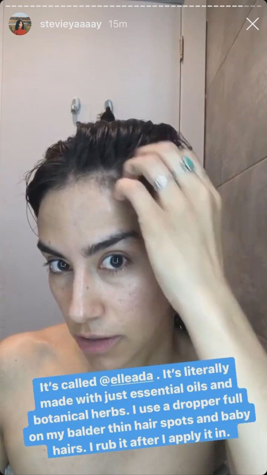 Person applying a product to their hairline with text overlay
