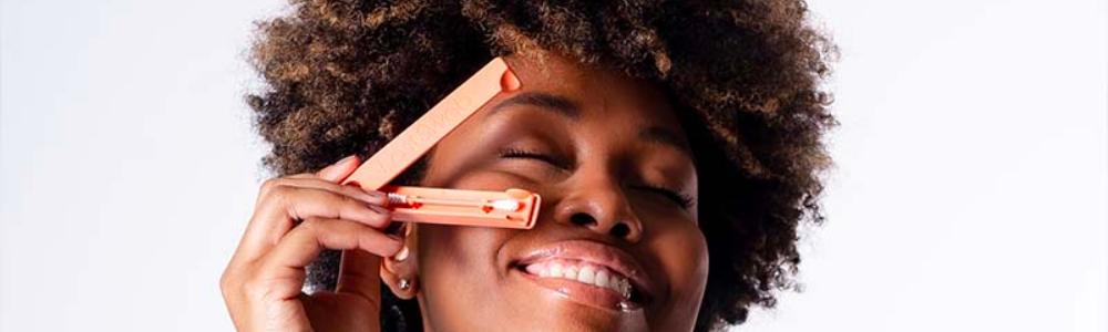 Person smiling while holding a LastObject reusable swab 