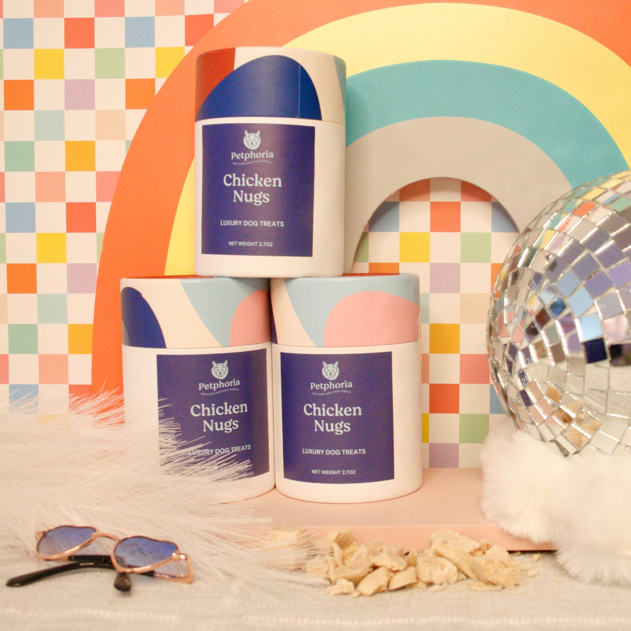 Three containers of 'Chicken Nugs' with a disco ball and sunglasses on a colorful checkered background