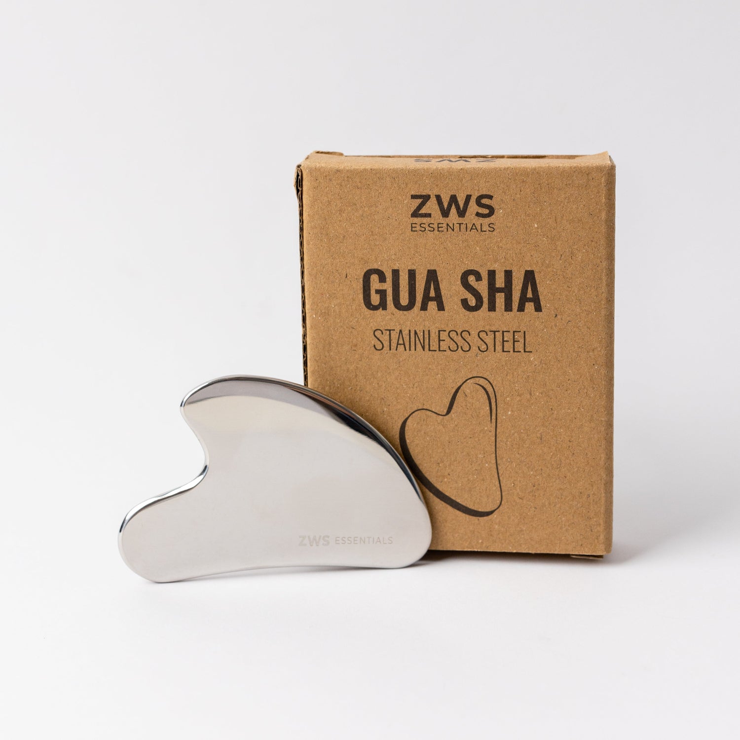 ZWS Essentials Gua Sha stainless steel tool with packaging on a white background